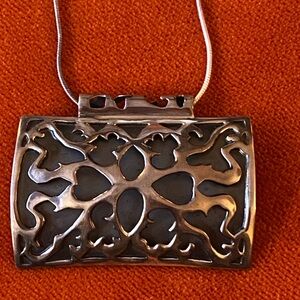 Silver Pendant with Intricate Design